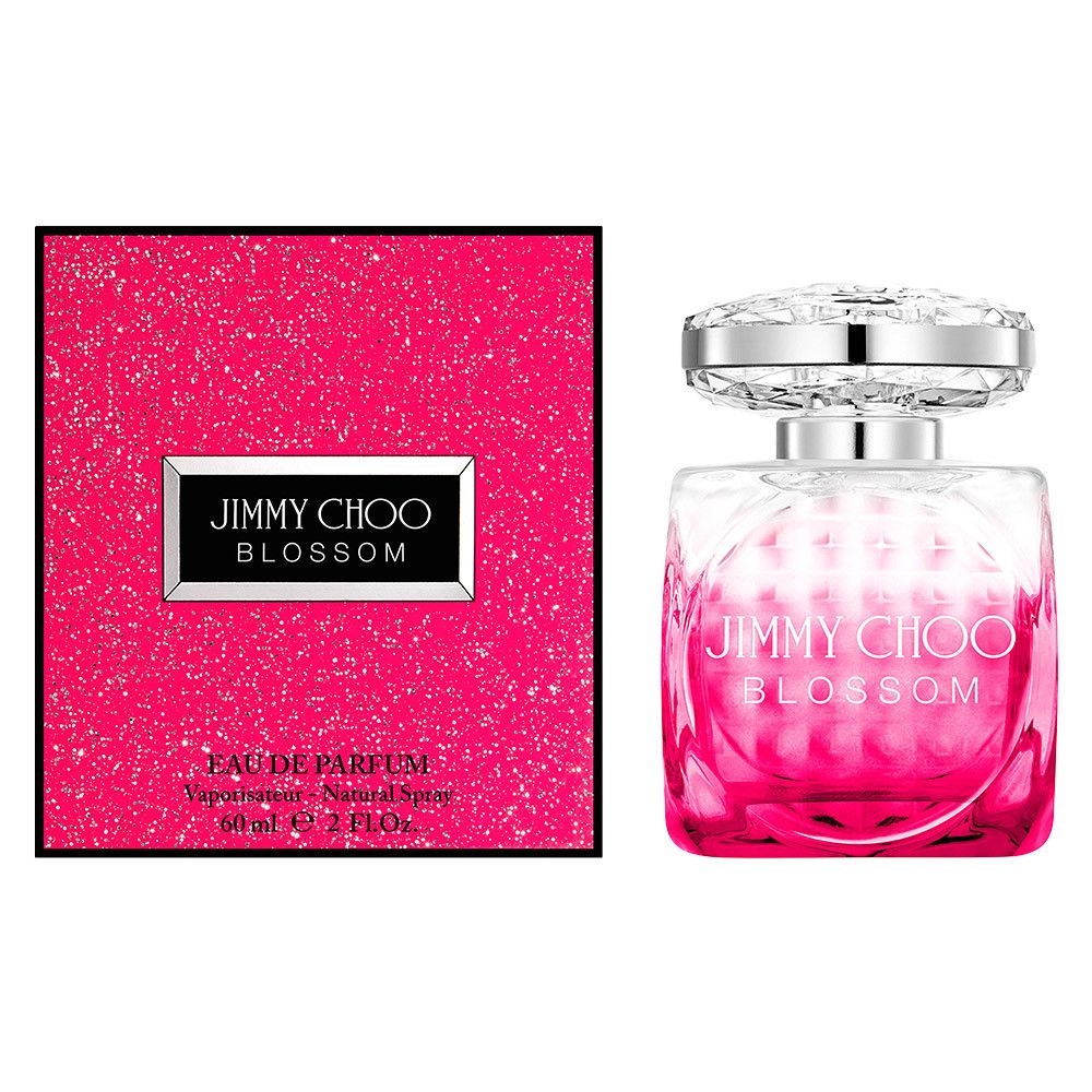 Flacon de parfum et emballage. Flacon avec bouchon argenté et dégradé rose. Emballage avec logo et texte.