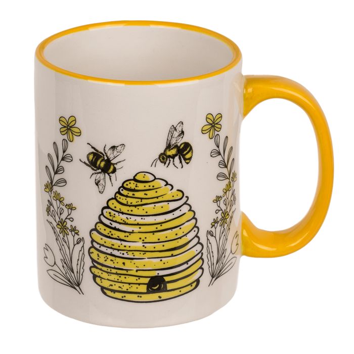 Keramische beker met gele handvat, bijen en honingraatpatroon. Gele rand.