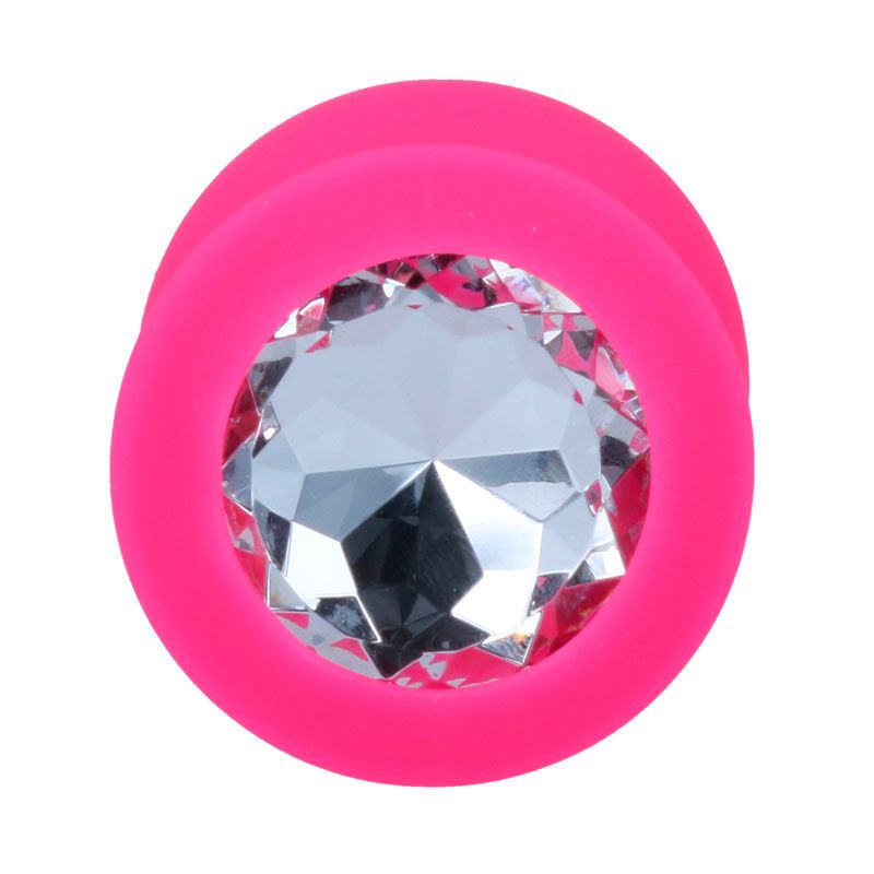 Gros plan du plug anal rose avec cristal dans la bride.