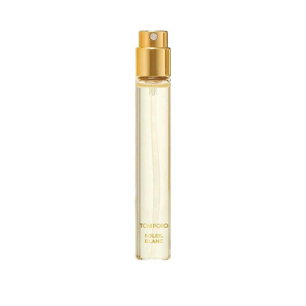 Parfumflesje met gouden verstuiver. Transparante, cilindrische houder met gelige vloeistof. Opschrift: TOM FORD, SOLEIL BLANC.