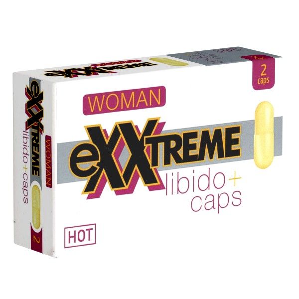 Capsules in een doos. Opschrift: eXXtreme Libido+ caps, HOT, WOMAN. Twee capsules ernaast.
