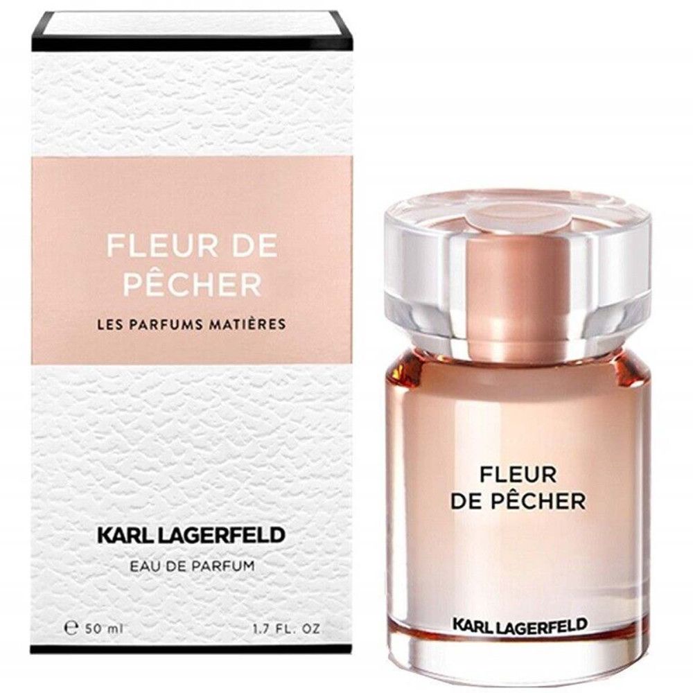 Fles en verpakking Fleur de Pêcher Eau de Parfum. Wit-roze design met tekst. Karl Lagerfeld logo.