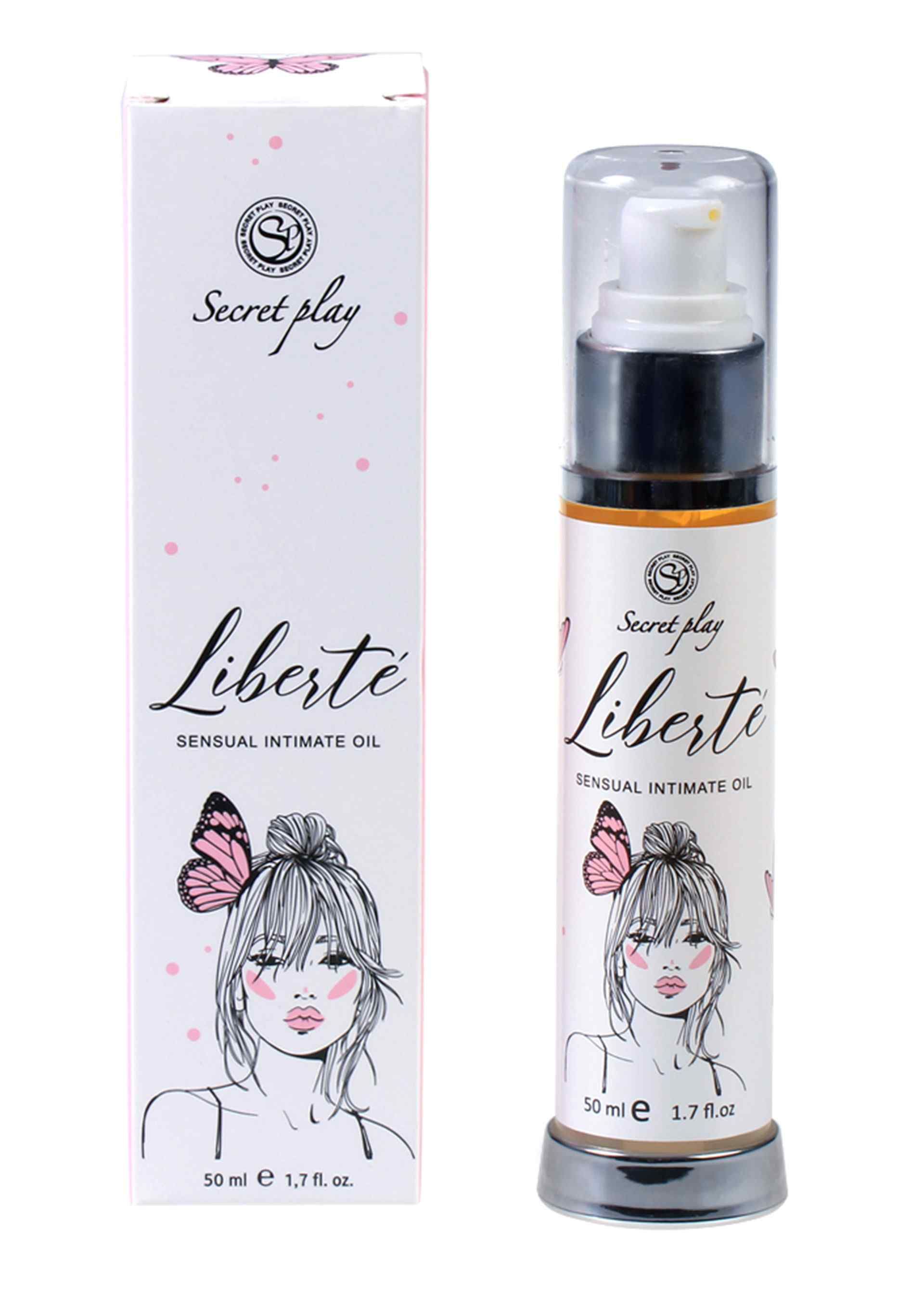 Deux produits: flacon et boîte. Inscription: Secret Play Liberté Sensual Intimate Oil. Illustration d'une femme avec un papillon.