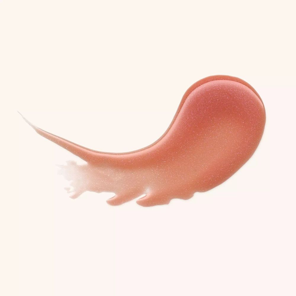 Échantillon de baume à lèvres brillant de couleur rose.