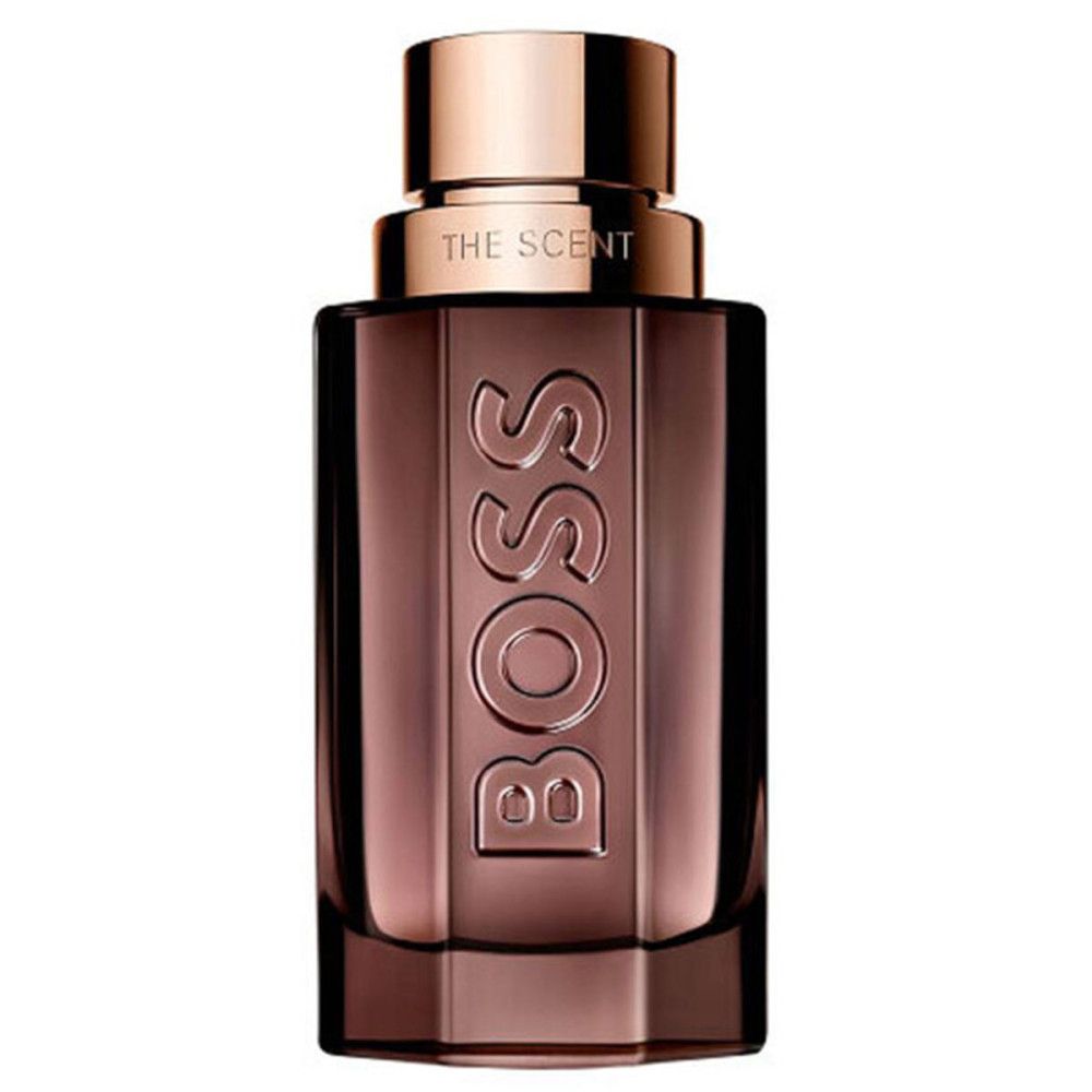 Parfumfles met BOSS-logo en opschrift "THE SCENT". Bruine glazen fles met koperkleurige dop.