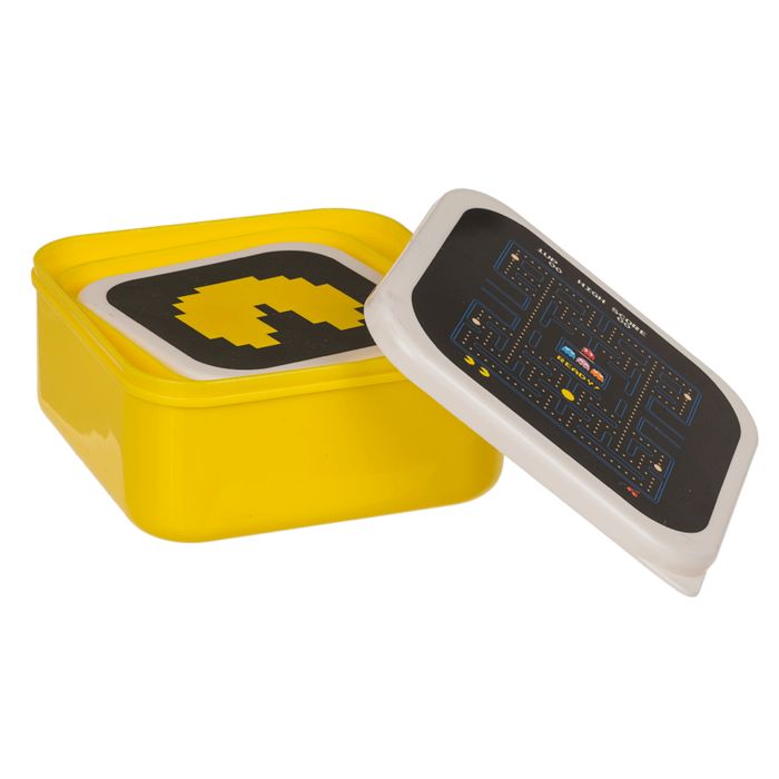 Gele brooddoos met Pac-Man-motief. Deksel met Pac-Man-spel. Deksel open.