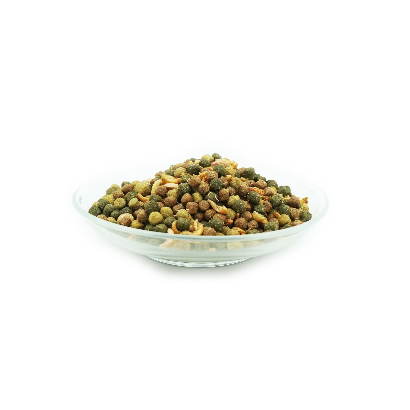 Aliments pour poissons dans un bol en verre. Différentes couleurs et formes. Petites granulés ronds.