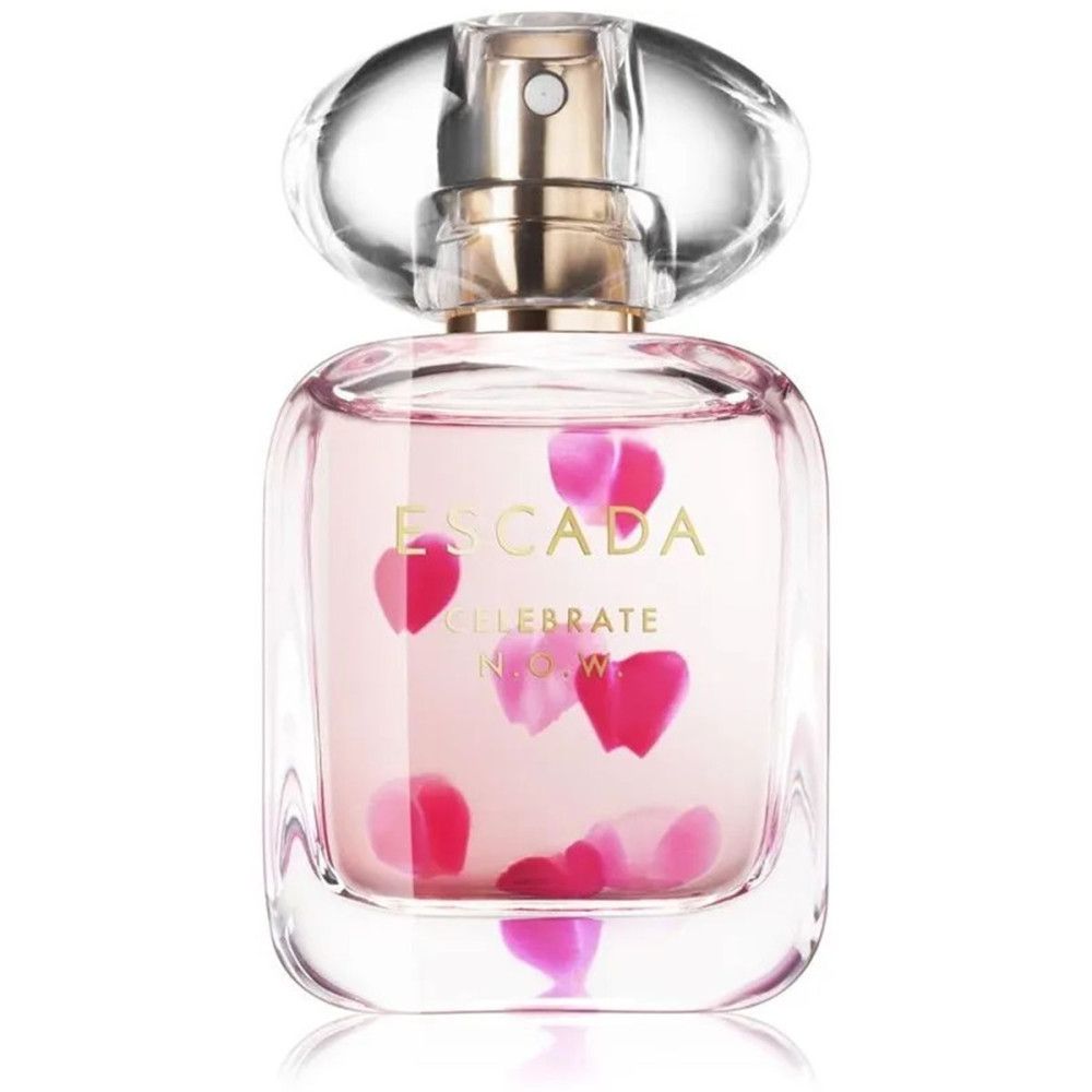 Escada Celebrate Now Eau de Parfum Spray in een glazen fles met bloemblaadjes.