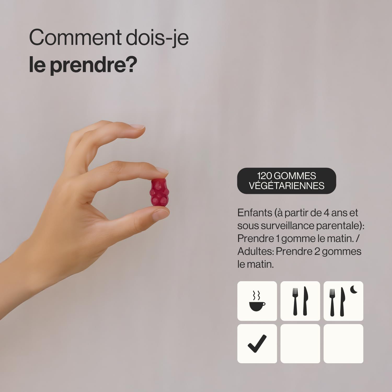 Gommette de supplément alimentaire rouge en forme d'ours, tenue par une main. Contient 120 gommettes végétariennes.