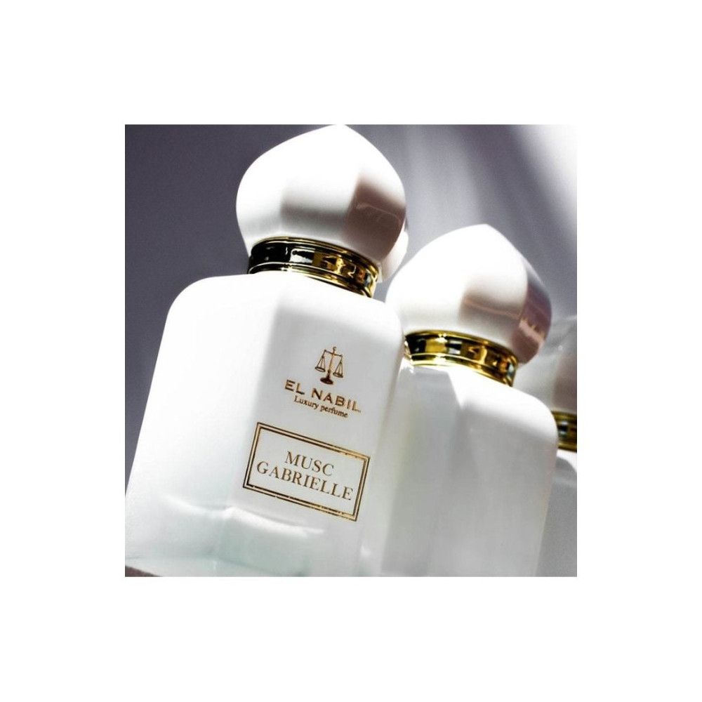 Deux flacons blancs avec détails dorés et bouchons. Inscription: El Nabil, Musc Gabrielle.