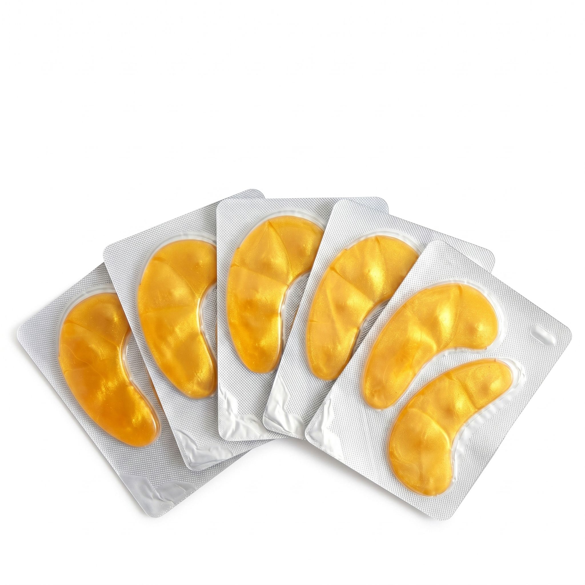 Cinq emballages individuels de patchs oculaires dorés, chacun contenant deux patchs.