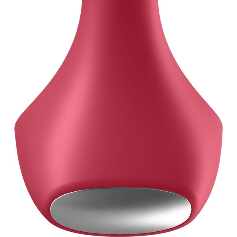 Close-up van de onderkant van een rode anale vibrator met een zilveren, cirkelvormige inzet.