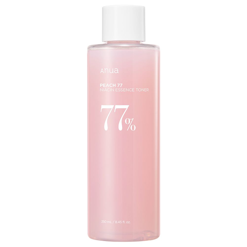 Une bouteille de toner essence niacine ANUA Peach 77% avec un bouchon blanc.