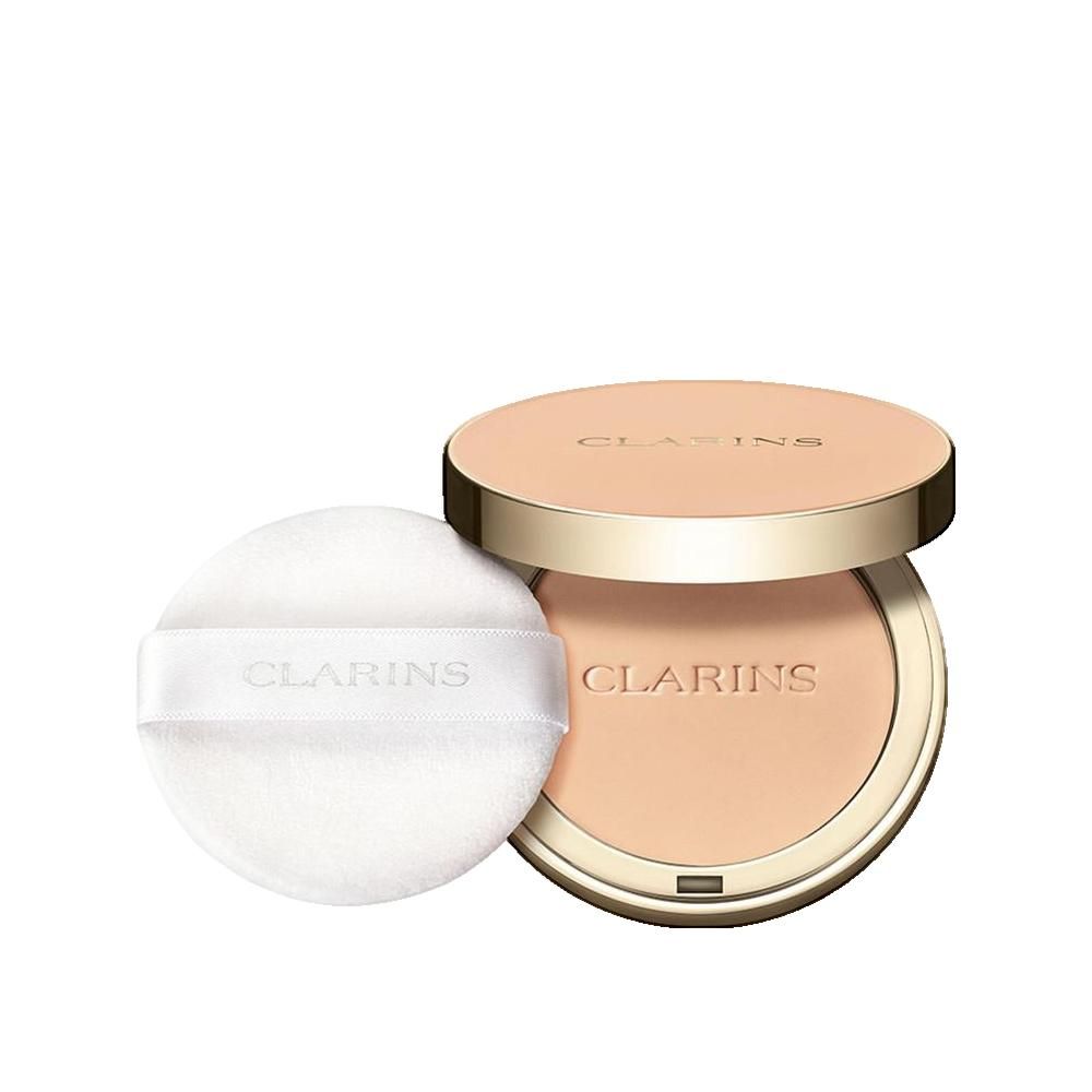 Compact poeder met spiegel en applicator. Gouden deksel met opschrift. Poeder in lichte tint. Applicator met band en opschrift.