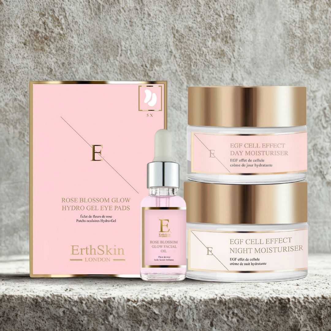 Ensemble avec patchs pour les yeux, huile faciale et deux crèmes. Emballage rose et doré. Inscriptions : EGF Cell Effect, Day Moisturiser, Night Moisturiser. Texte : ErthSkin London.