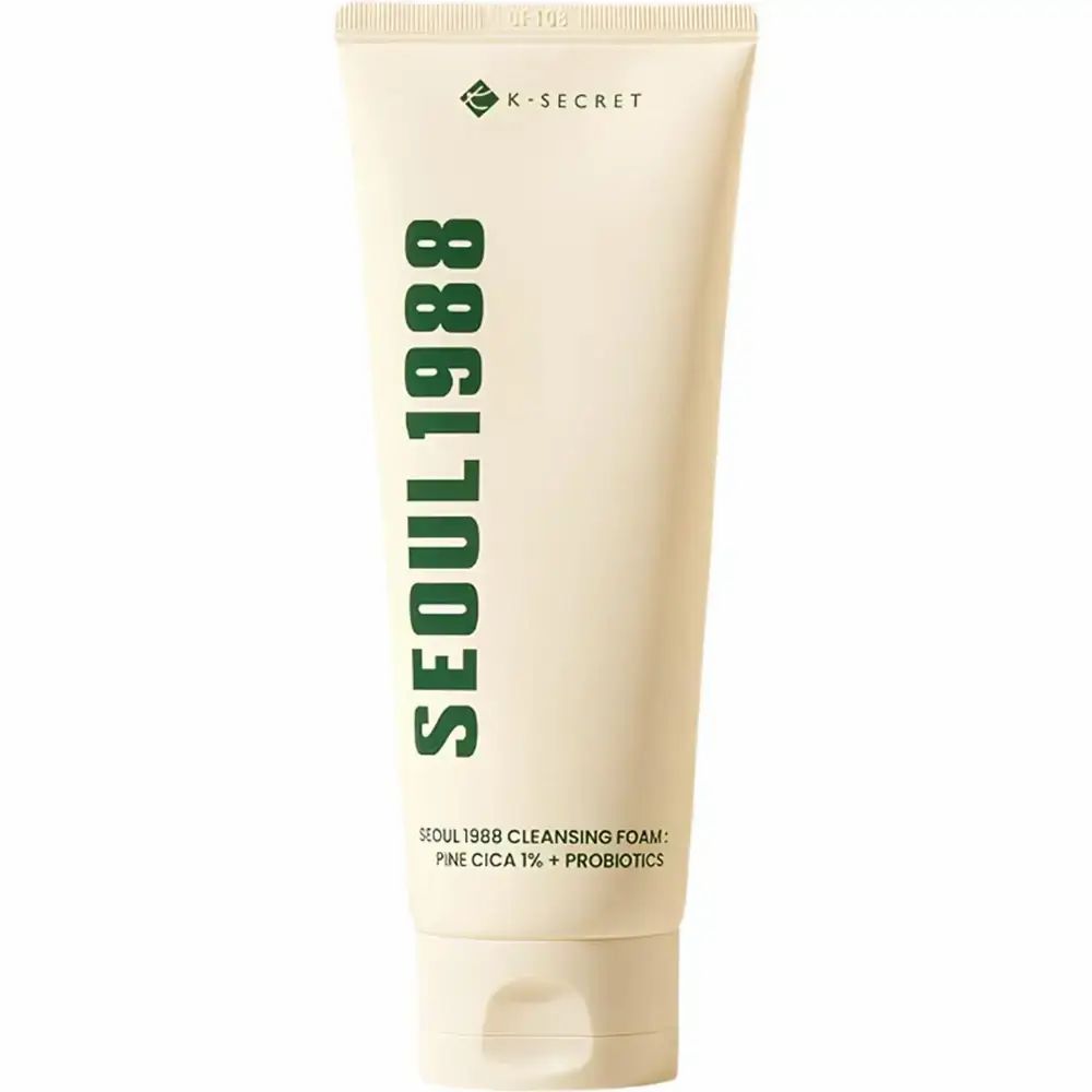 Tube de crème avec texte vert. Inscription : SEOUL 1988. Logo K-SECRET. Nom du produit.