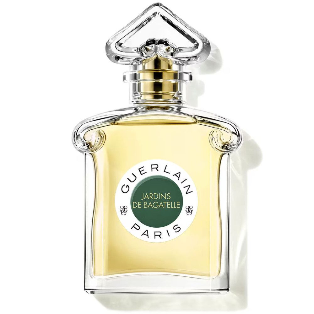 Parfumfles met etiket. Opschrift: Guerlain, Jardins de Bagatelle, Paris. Transparante fles.