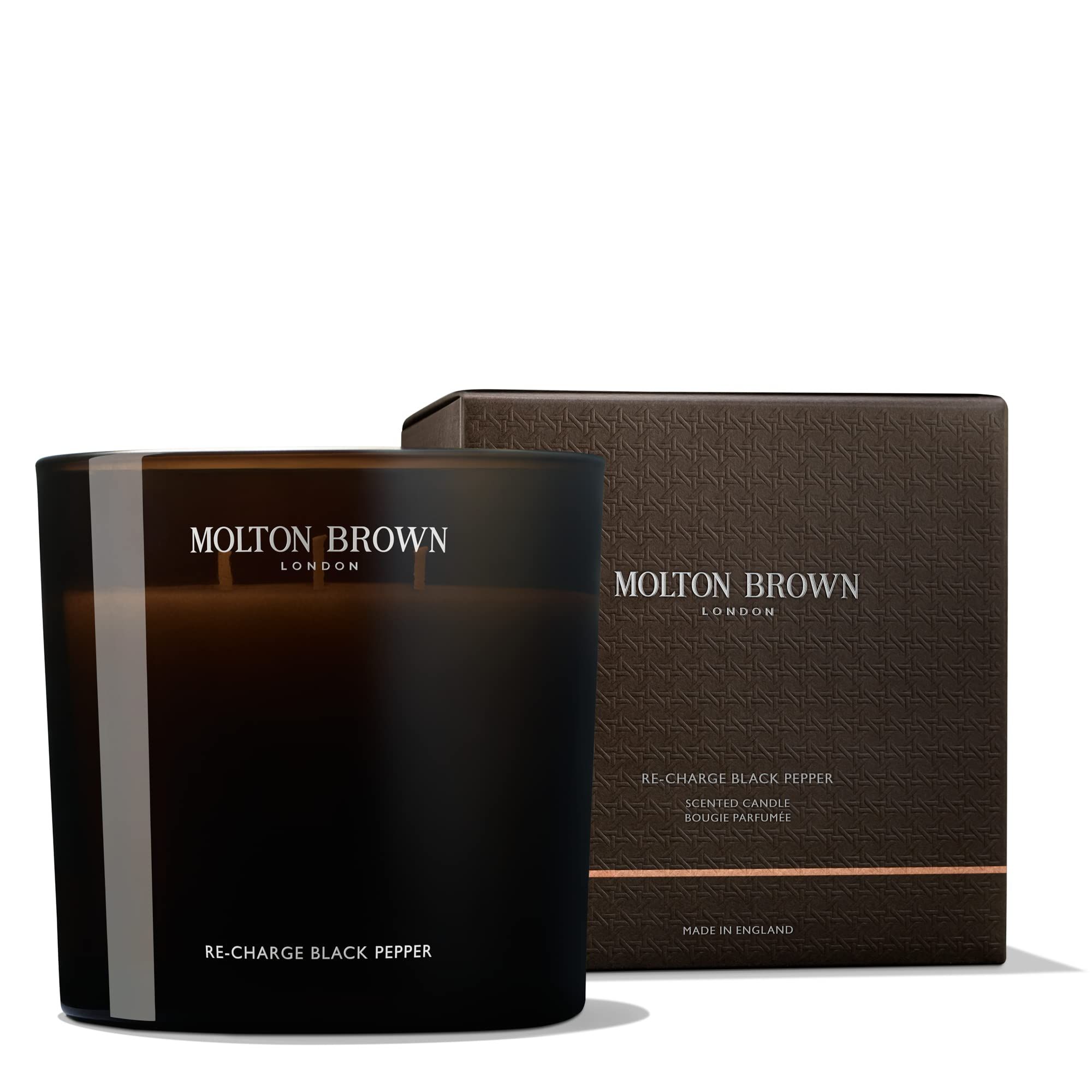 Bougie parfumée Molton Brown Re-Charge Black Pepper dans son verre avec emballage.