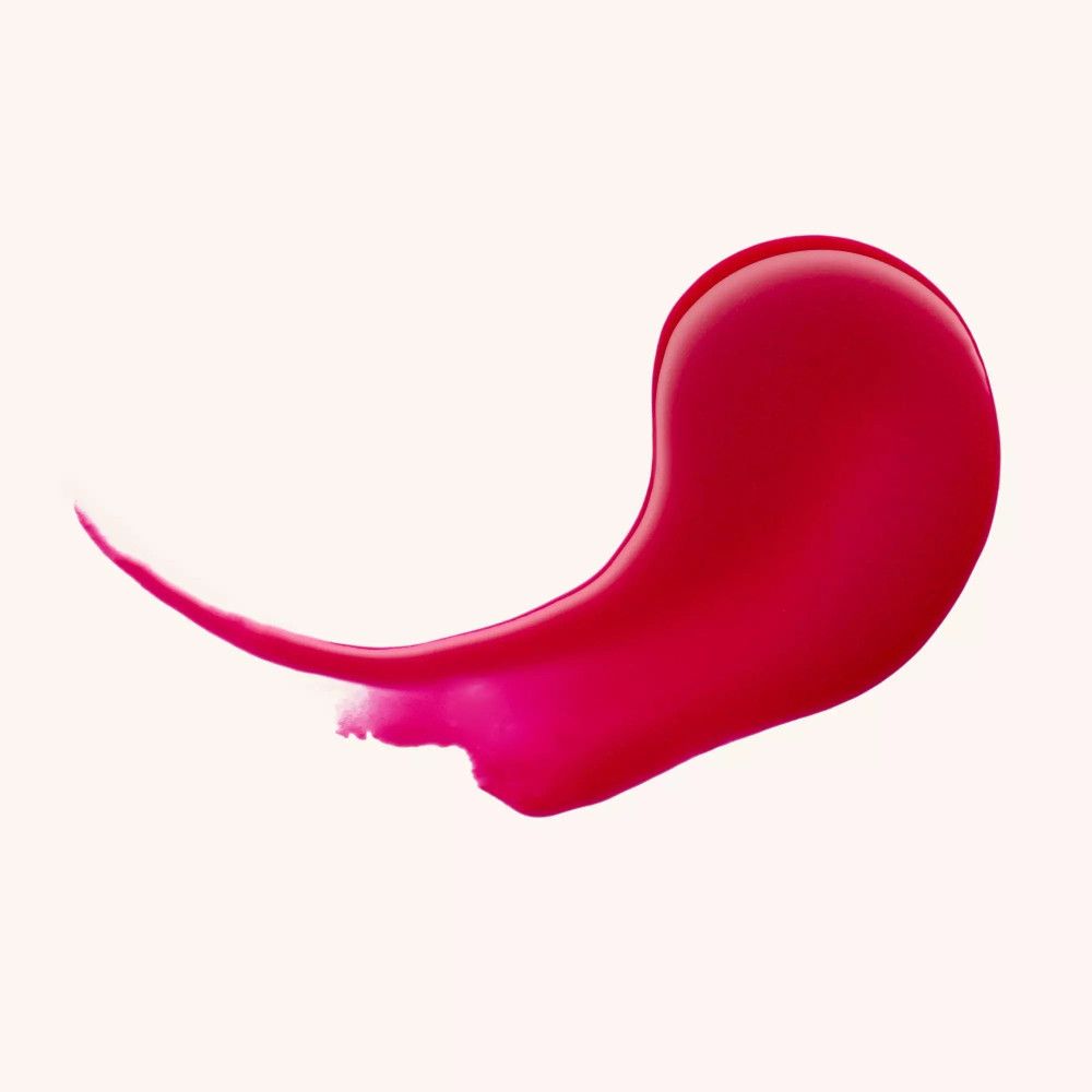 Baume à lèvres rouge brillant. Sur fond clair.