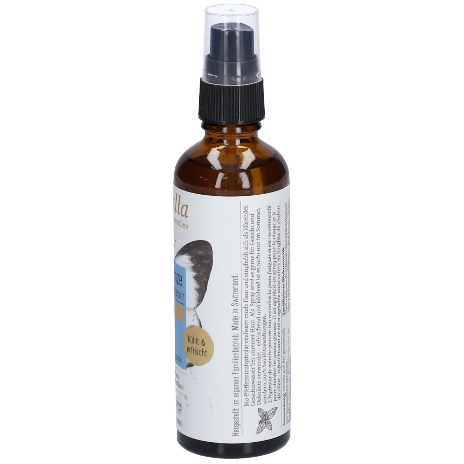 Flacon en verre brun avec vaporisateur. Étiquette avec informations produit et texte. Informations de fabrication et de durabilité.