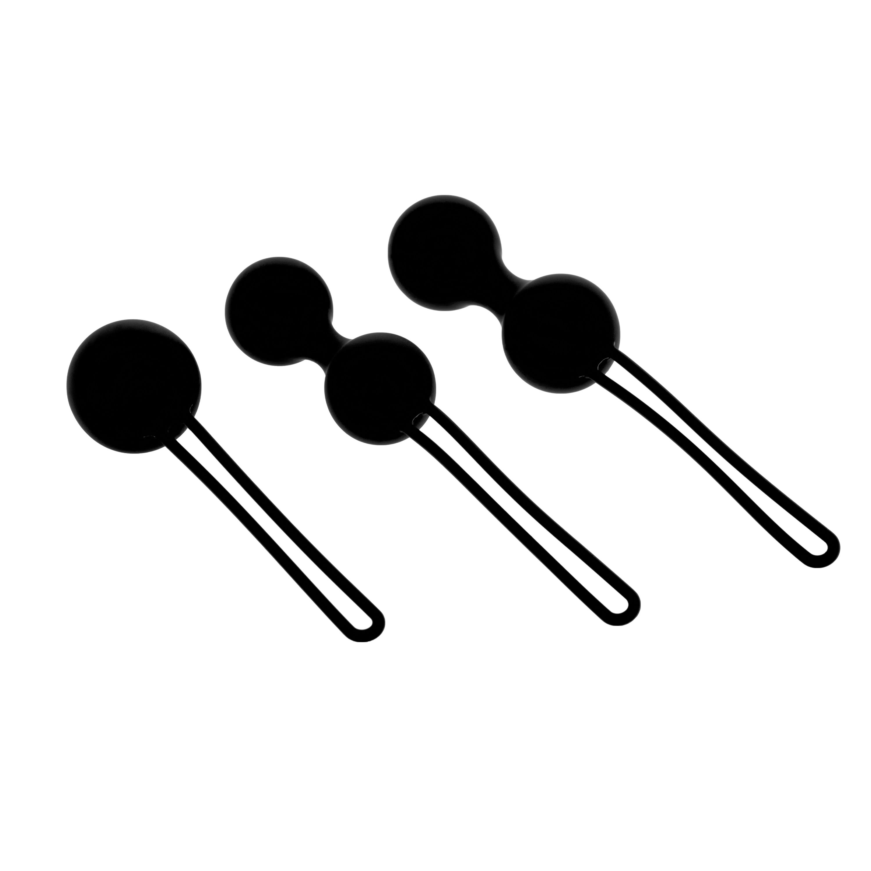 Drie zwarte ballen met lussen. Twee ballen zijn verbonden. Allemaal rond van vorm.