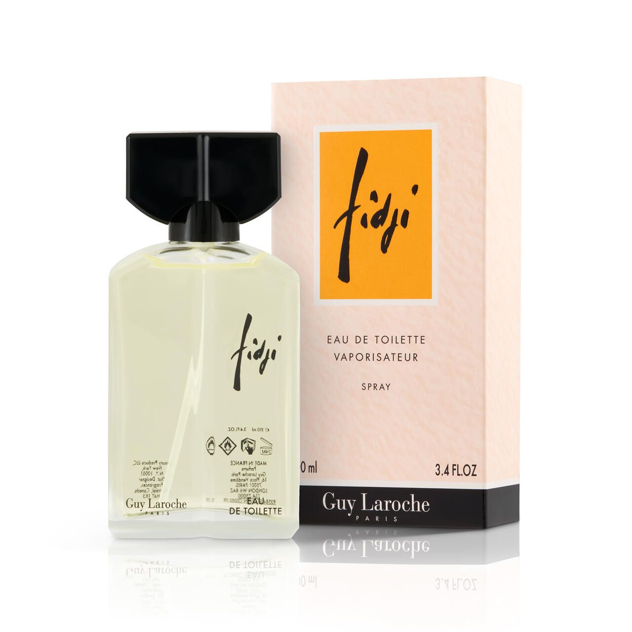 Fidji Eau de Toilette fles en verpakking. Vierkante glazen fles met zwarte dop. Verpakking met geel veld en opschrift Fidji.