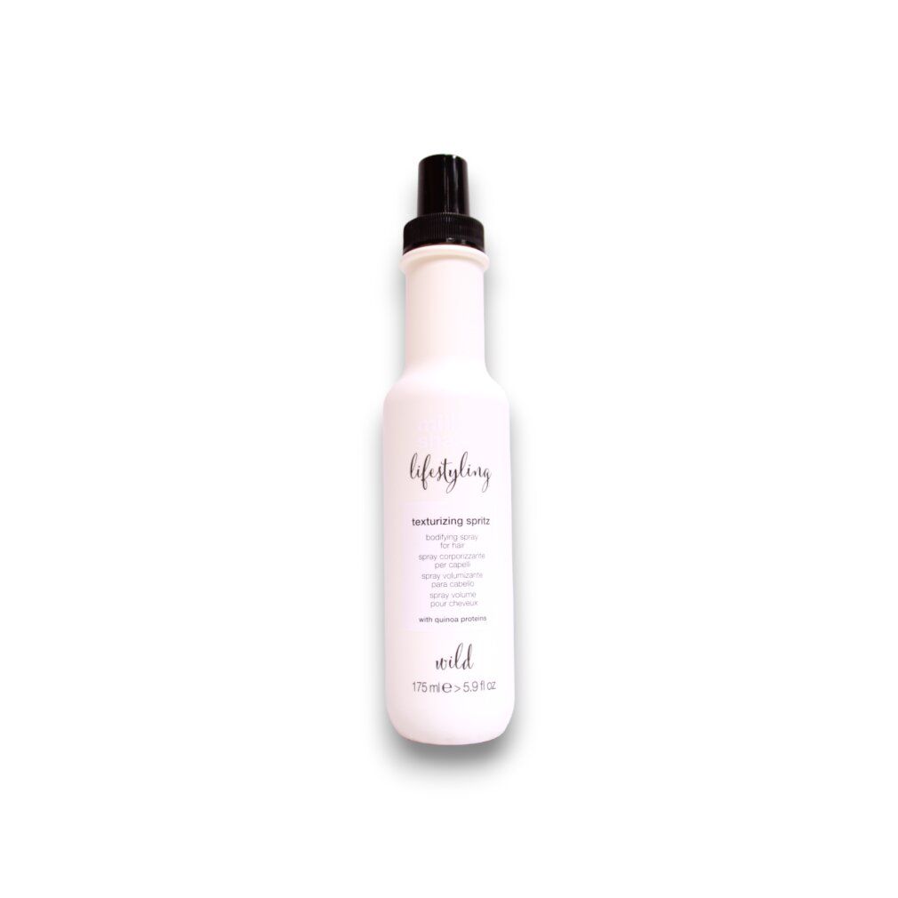 Flacon rose avec vaporisateur noir. Inscription : Milk_shake, Lifestyling, Texturizing Spritz. 175ml.