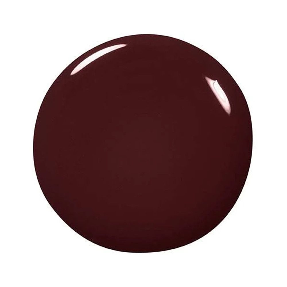 Tache ronde et brillante. Couleur rouge foncé.