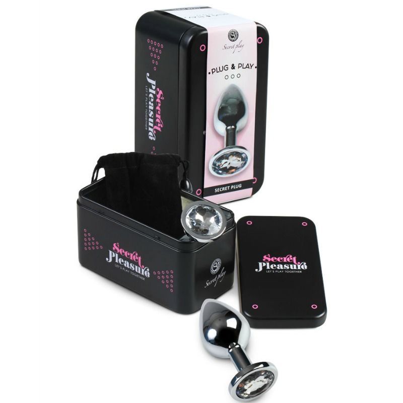 Een anale plug met kristallen handvat, gepresenteerd in een zwarte metalen doos met productinformatie.