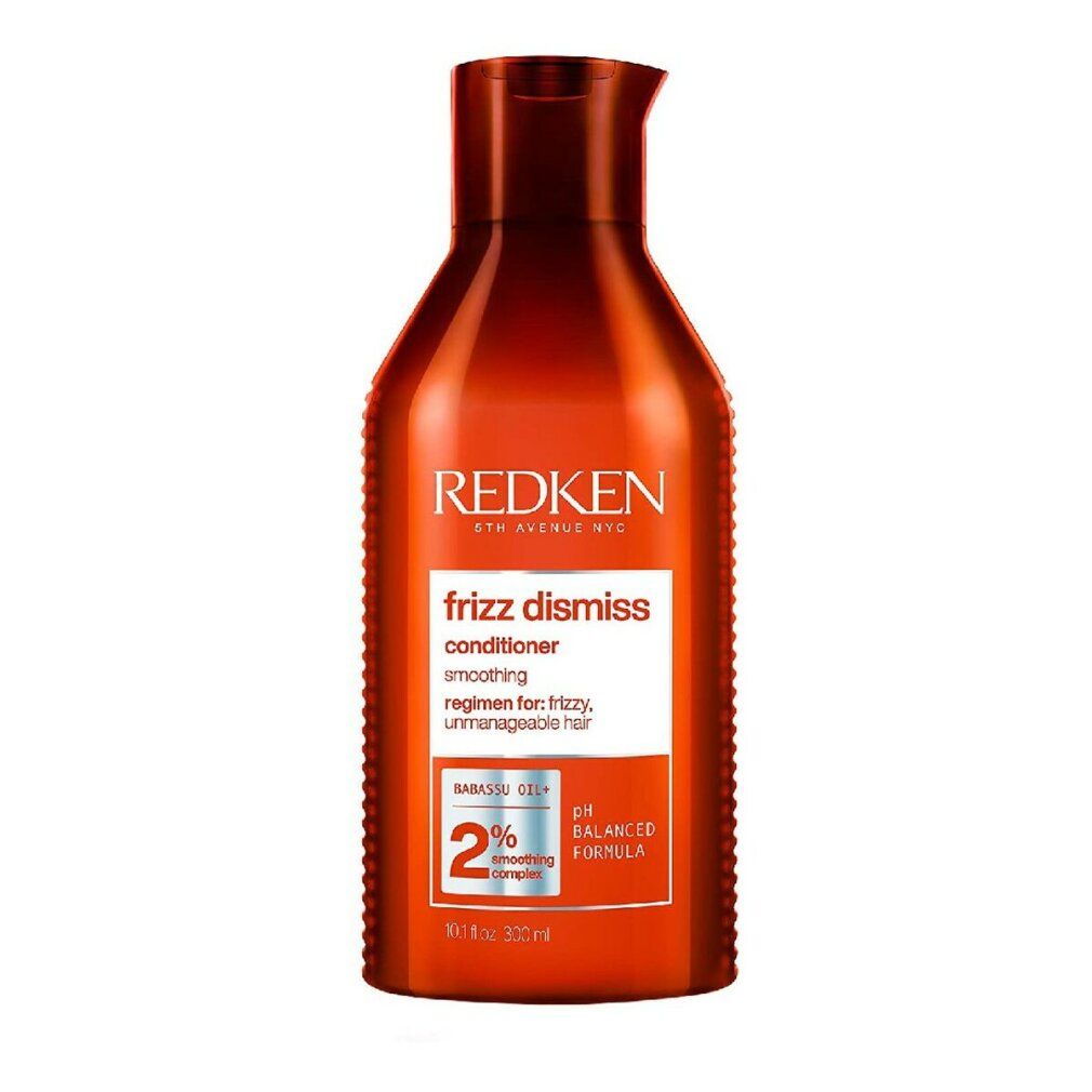 Rode fles Redken Frizz Dismiss Conditioner. Tekst: gladmakend, voor kroes, weerbarstig haar. pH-gebalanceerd.