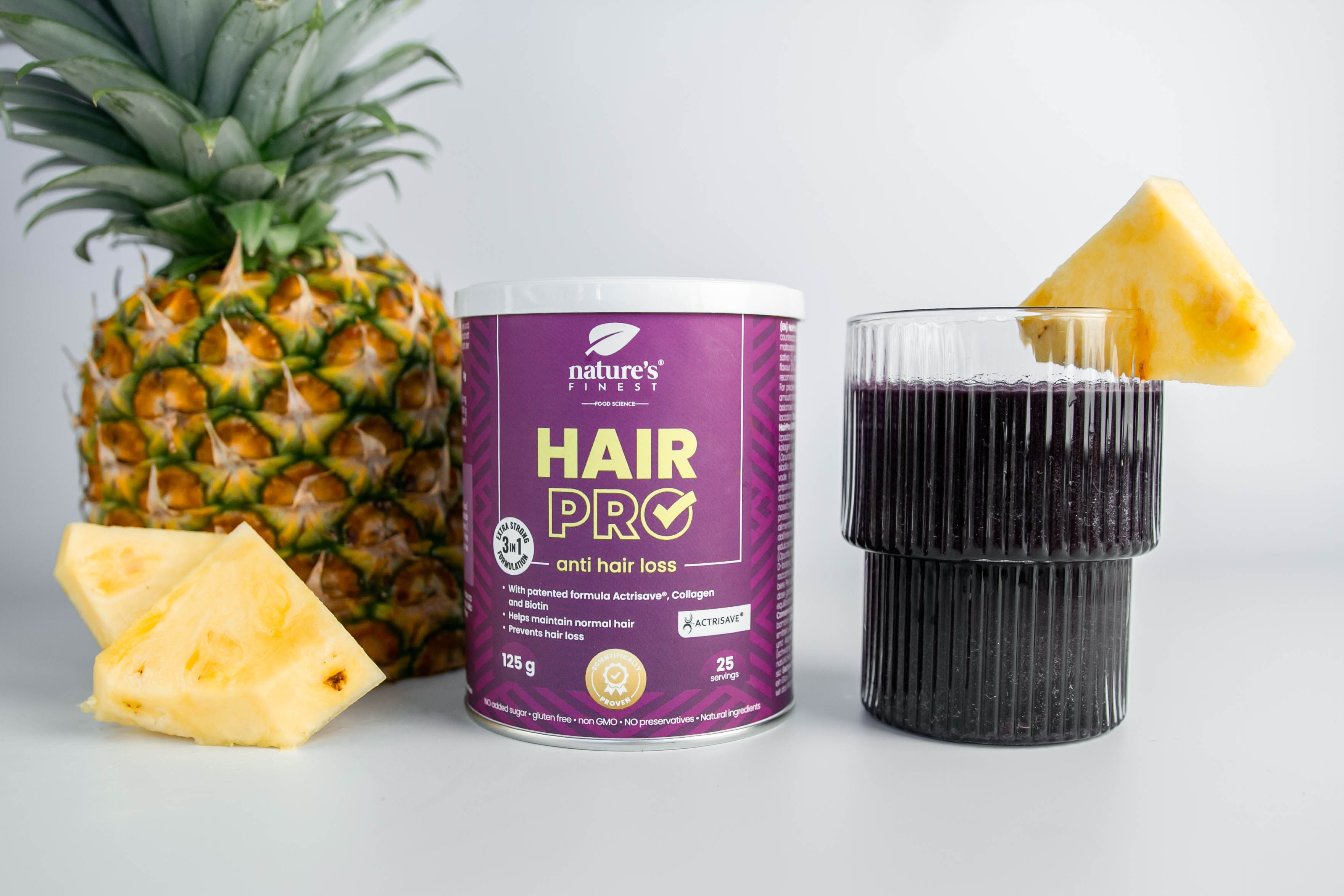 Pot Nature's Finest Hair Pro, ananas, glas met drank. Opschrift: Hair Pro, tegen haaruitval. 125g, 25 porties.
