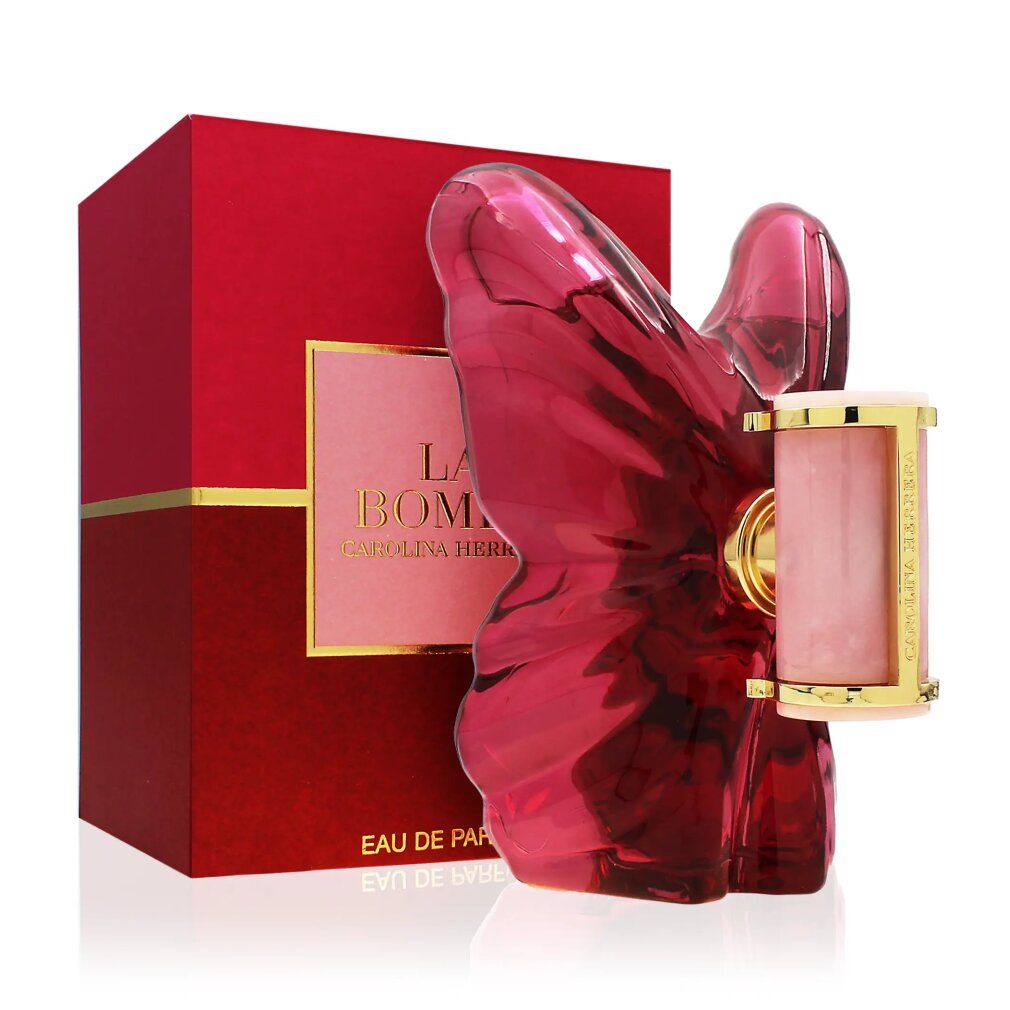 Flacon papillon rose et boîte rouge. Cylindre doré avec nom du produit. Liquide rose visible.