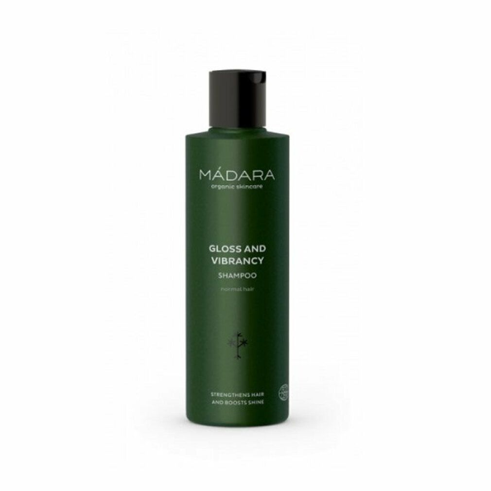 Flacon vert avec bouchon noir. Inscription: MÁDARA organic skincare, Gloss and Vibrancy Shampoo, renforce les cheveux et apporte de la brillance.