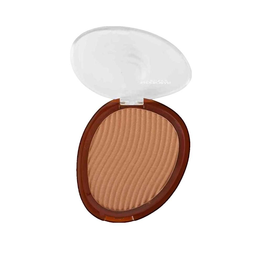 Bronzer in ovale verpakking met transparante deksel. Bruine kleur met golvende oppervlakte.