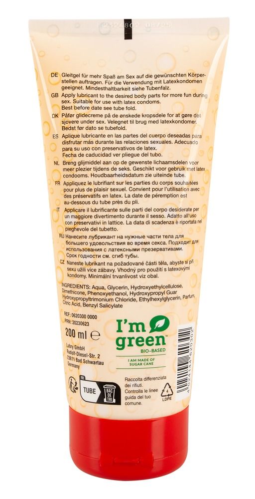 Dos d'un tube. Texte en plusieurs langues. Contient des informations sur les ingrédients et l'utilisation. Bouchon rouge.