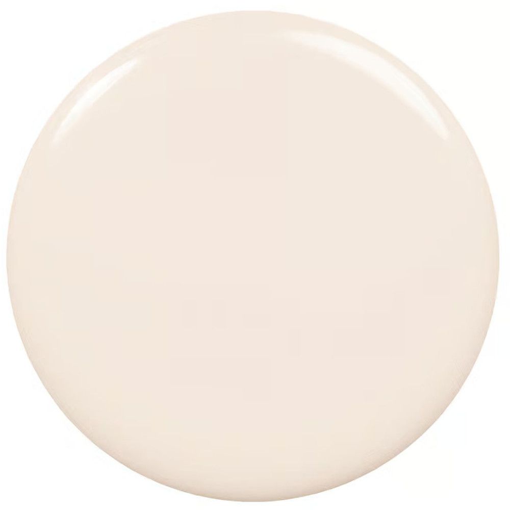 Tache circulaire de vernis à ongles beige clair. Surface brillante.