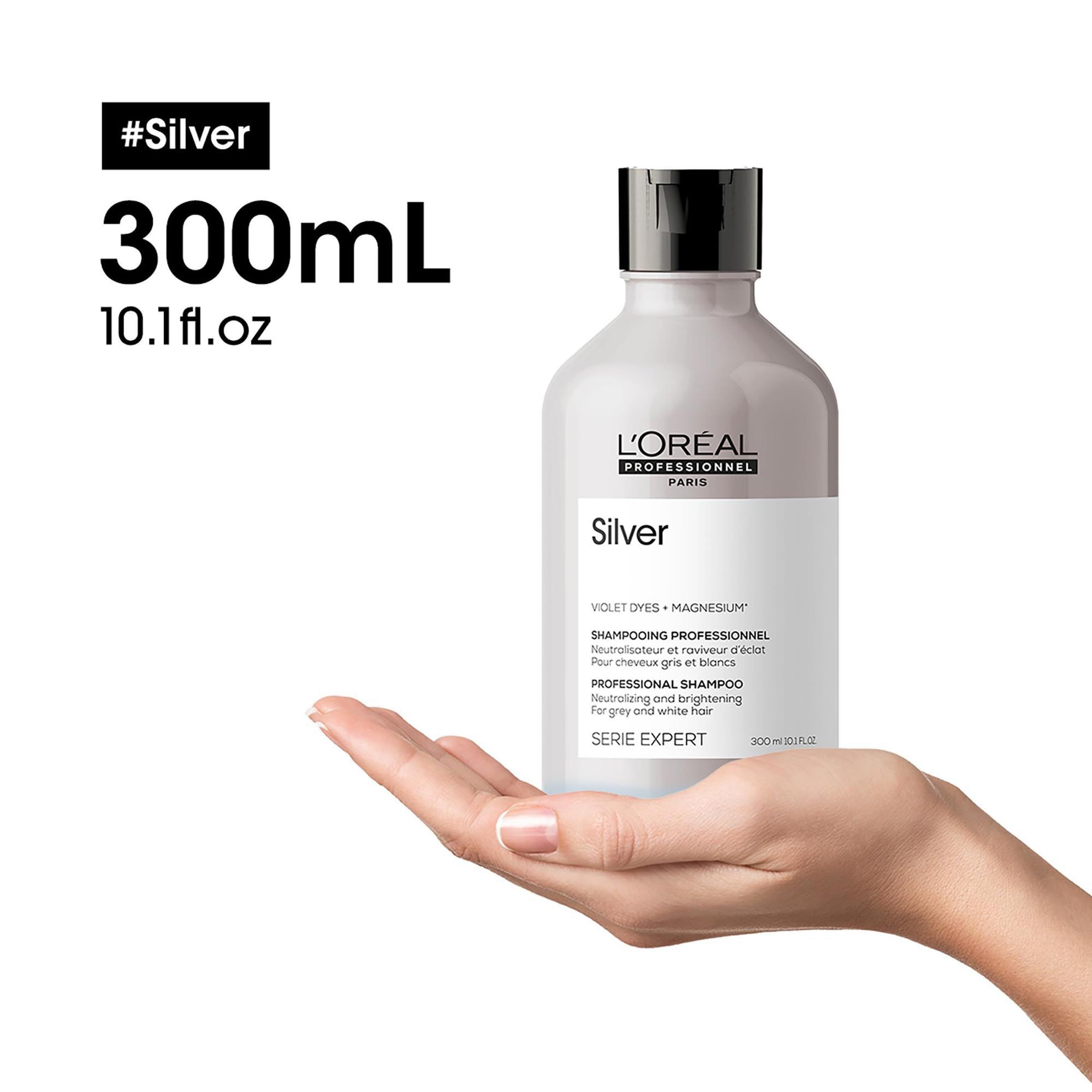 Flacon de shampooing argenté, tenu dans une main. Texte : Silver, L'Oréal Professionnel. 300 ml, 10,1 fl.oz.