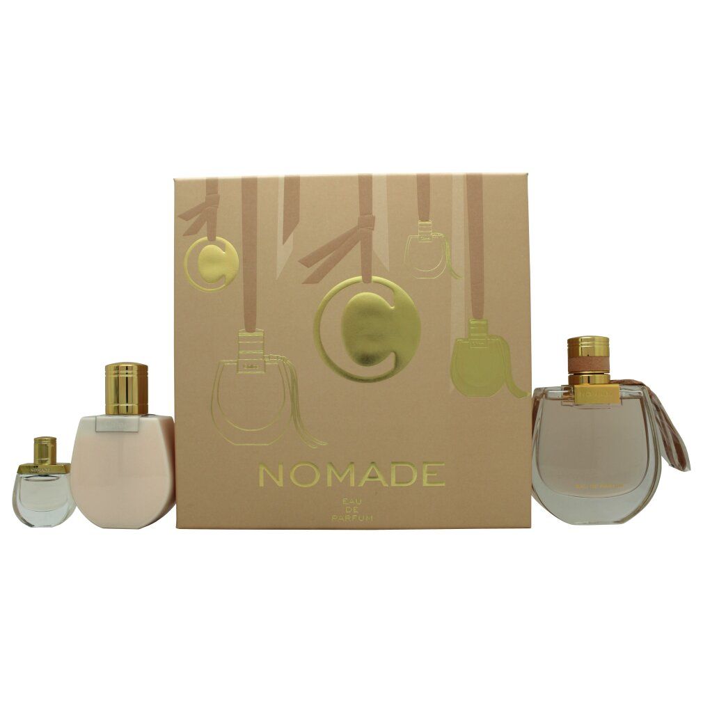 Cadeauset met drie parfumflesjes en een doos. De doos toont de tekst "NOMADE".