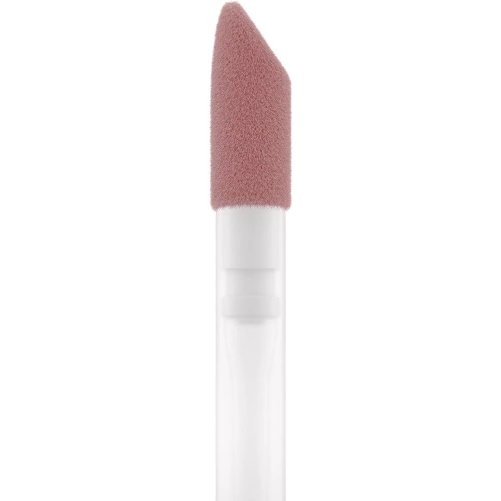 Close-up van de applicator van een lipgloss. Roze spons tip. Witte steel.