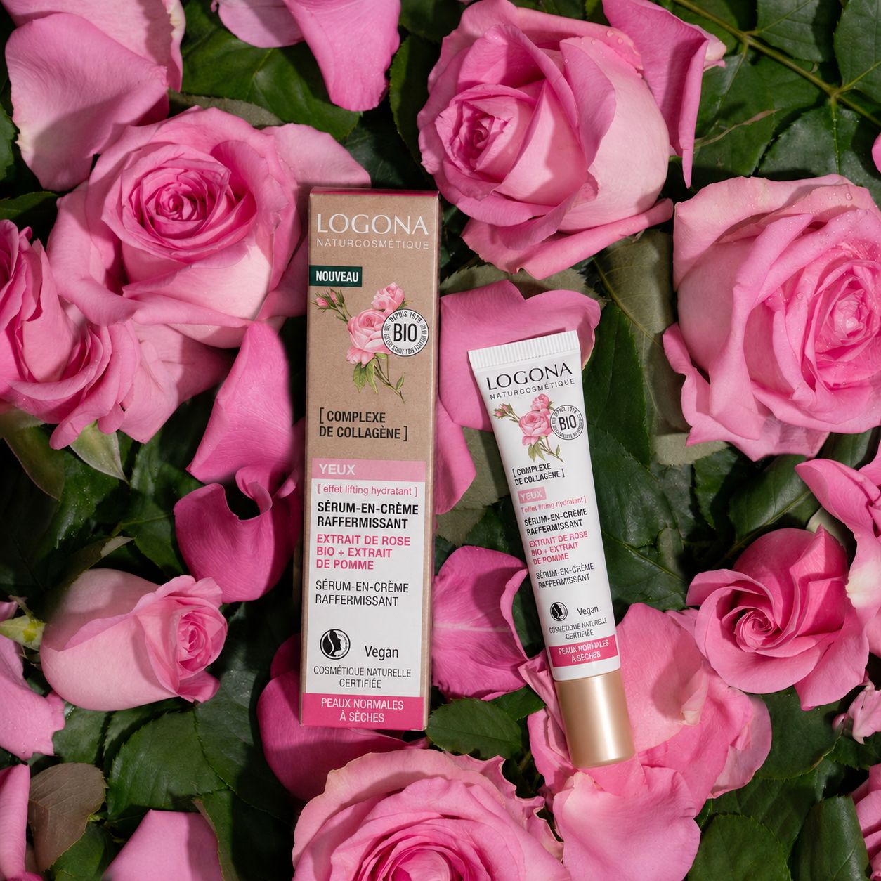 Crème contour des yeux et boîte LOGONA entourées de pétales de rose.