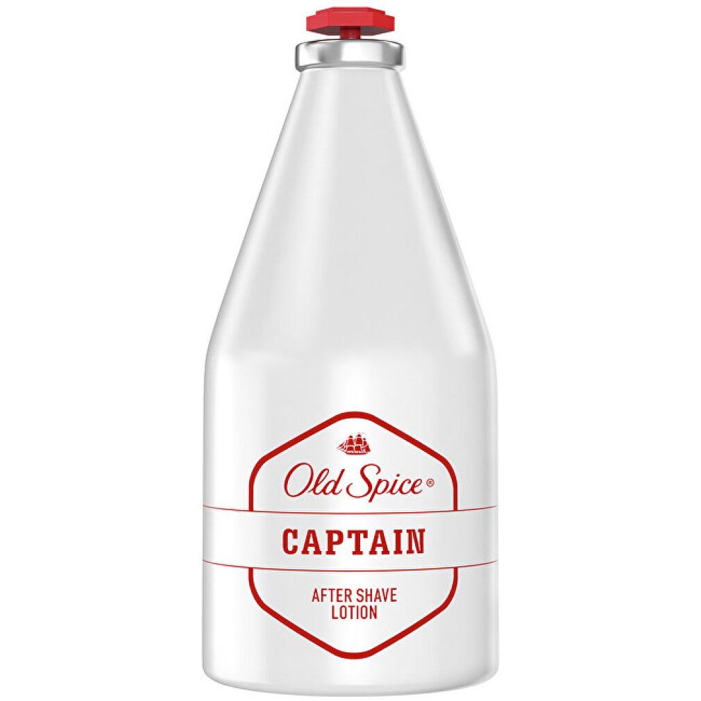 Witte fles met rode dop. Opschrift: Old Spice Captain After Shave Lotion.