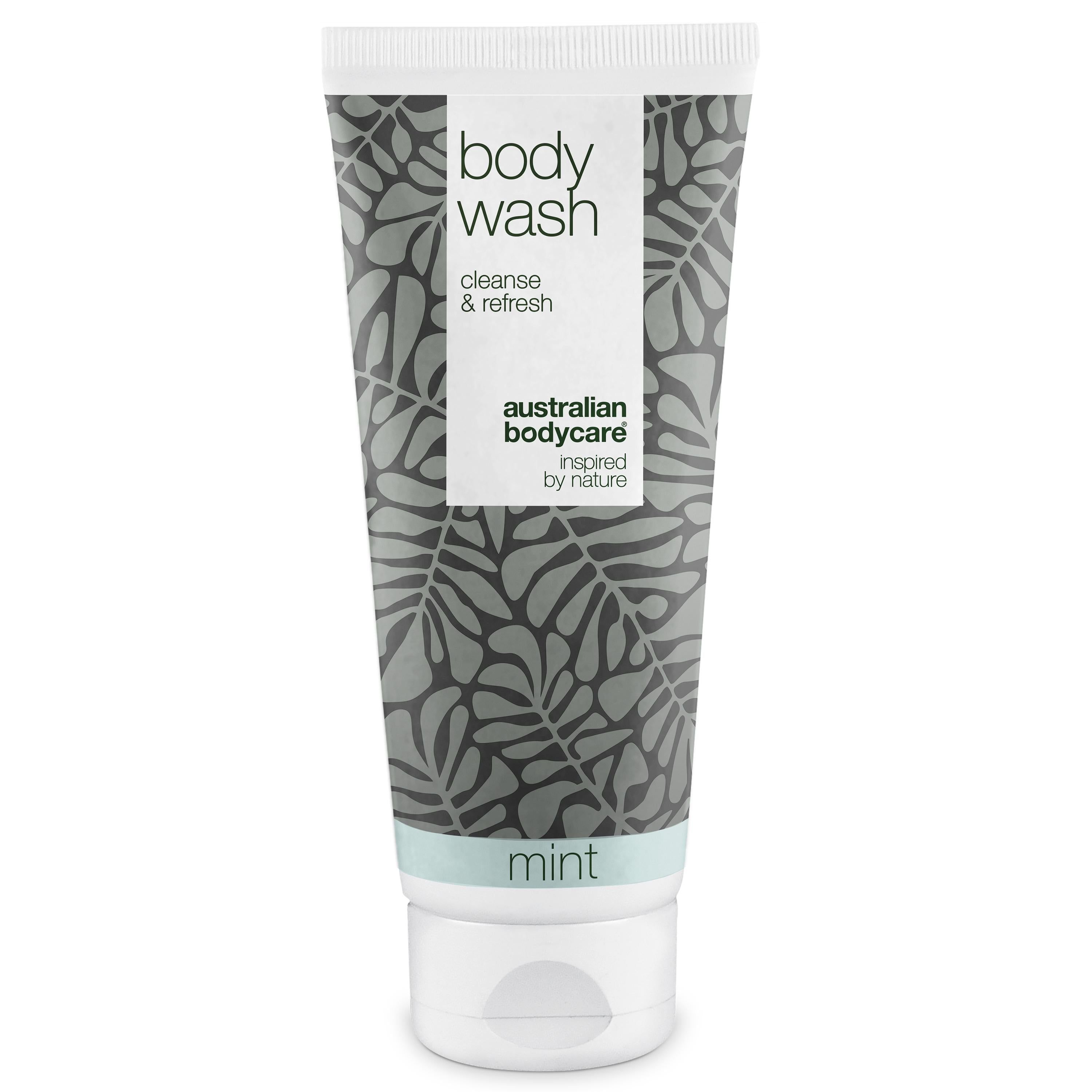 Tube blanche et grise avec « body wash » et « australian bodycare ». Motif menthe et texte vert.