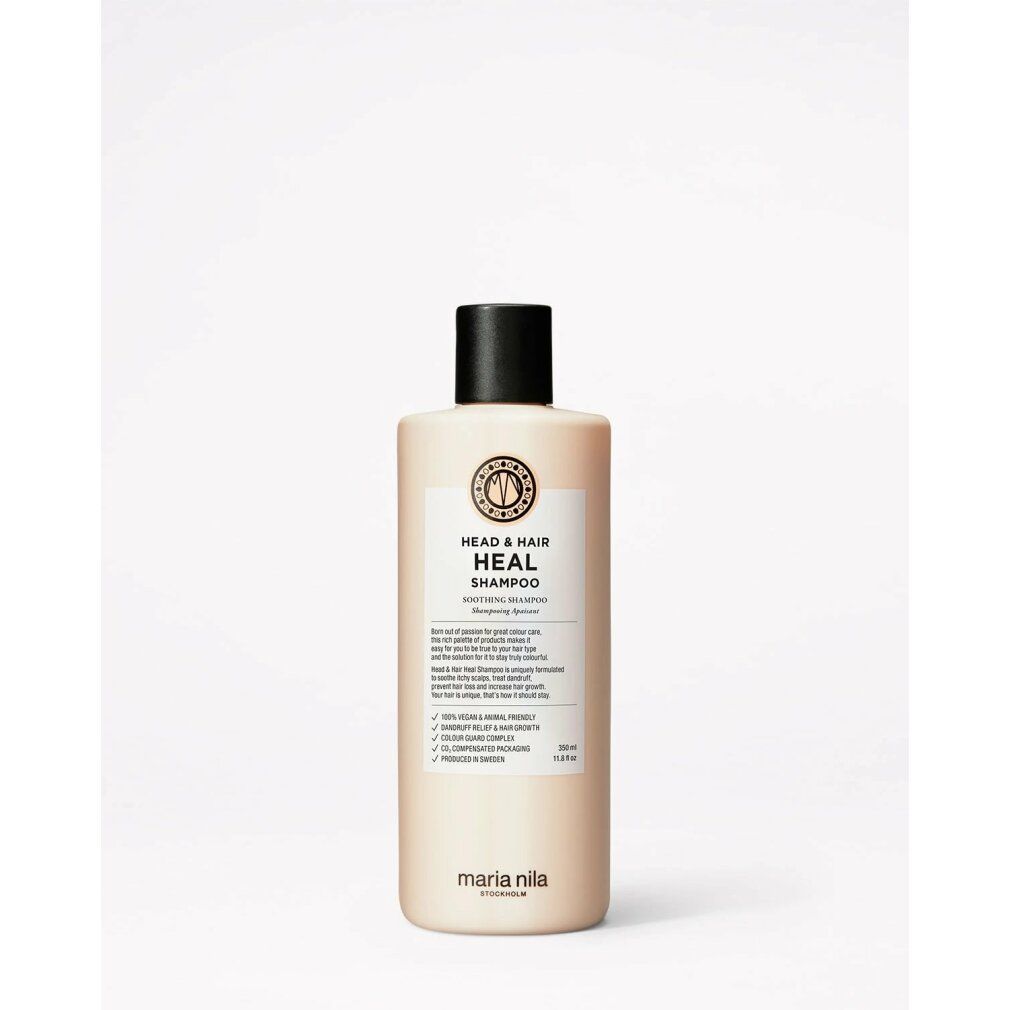 Maria Nila Head & Hair Heal Shampoo. Beige fles met zwarte dop. Etiket met productinfo en logo. Vegan en dierproefvrij.