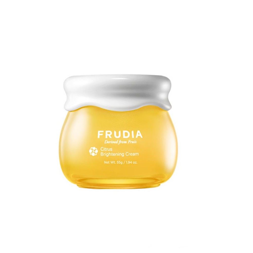 Crème éclaircissante Frudia Citrus dans un pot en verre jaune avec un couvercle blanc.