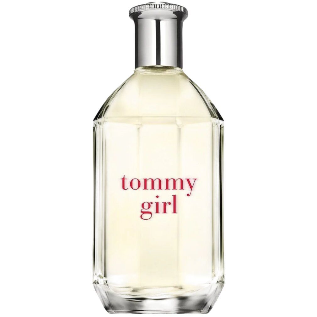 Flacon de parfum. Liquide clair dans un flacon en verre anguleux. Bouchon argenté. Inscription 'tommy girl' en rouge.