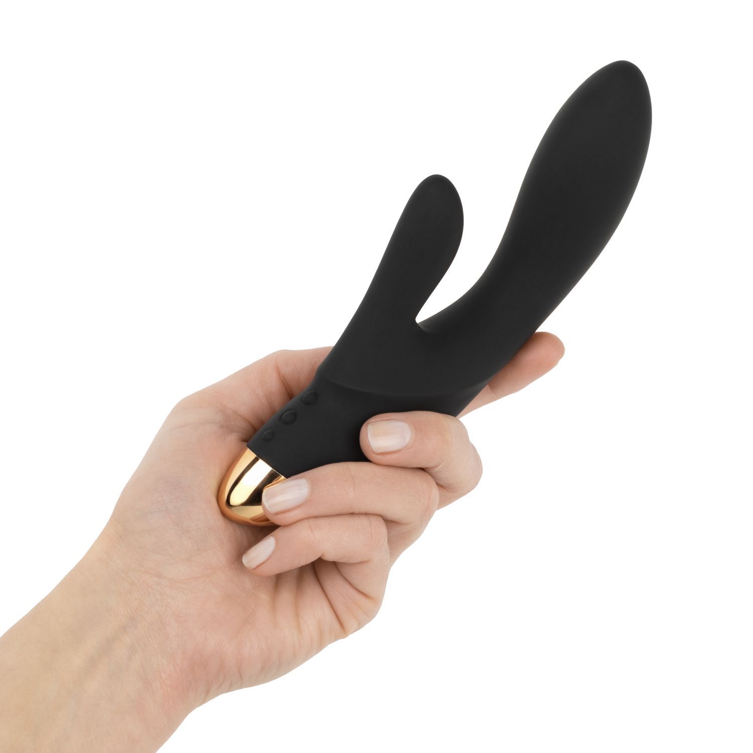Vibrateur lapin noir avec embout doré, tenu dans une main.