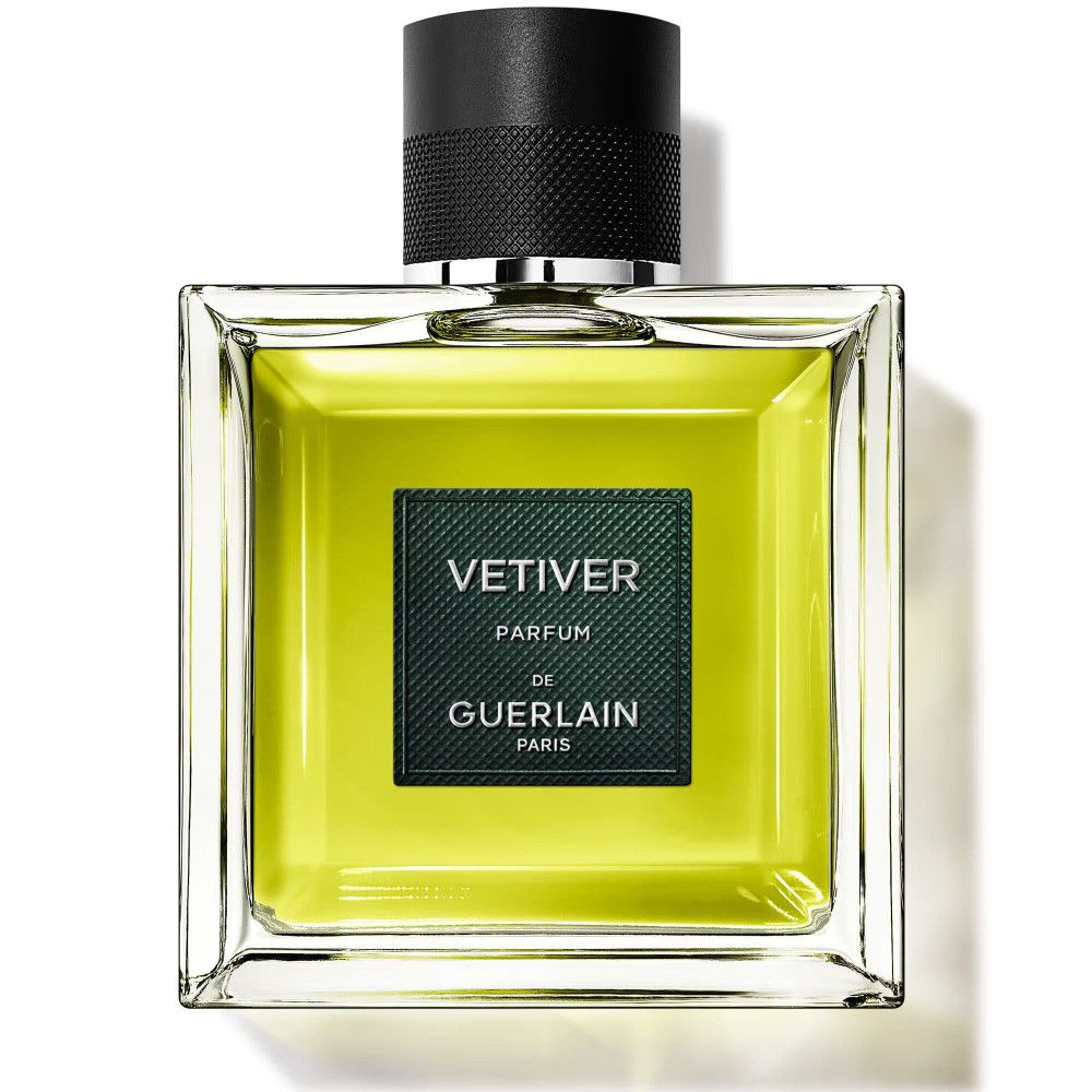 Flacon carré en verre avec liquide verdâtre. Bouchon noir. Étiquette "VETIVER PARFUM de GUERLAIN PARIS".