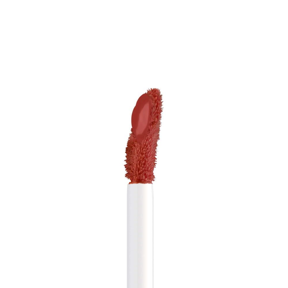 Applicator van de Artdeco Mat Passion Lip Fluid met koraalrode vloeistof.