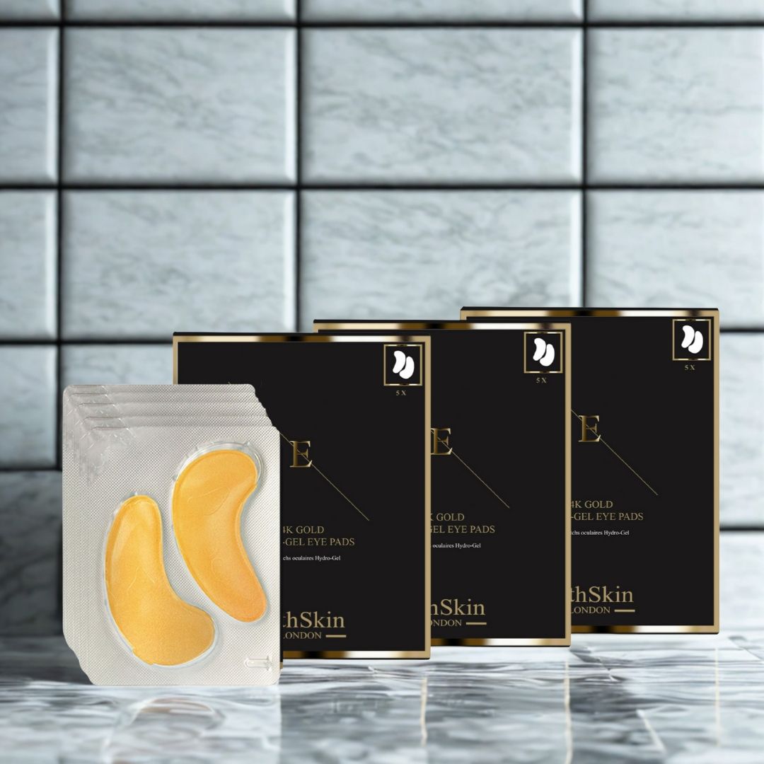 Verpakking oogpads en drie dozen. De pads zijn goudkleurig. Op de dozen staat "ErthSkin London".