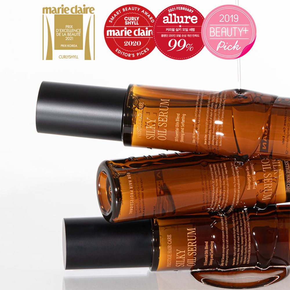 Drie bruine haarolieflessen met zwarte doppen. Opschrift: Silky Oil Serum. Onderscheidingen.